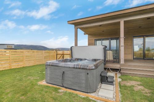 a large hot tub sitting outside of a house at Rare Fall Dates Hot Tub & Game Room Dogs in Driggs