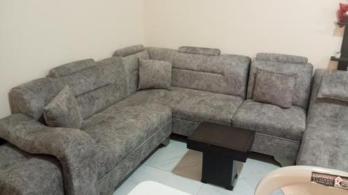 a large brown couch in a living room at Reservacion Sandrita in Ballenita