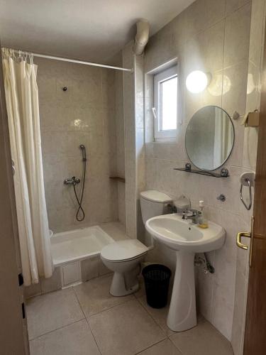 a bathroom with a sink and a toilet and a shower at Better place in Becici