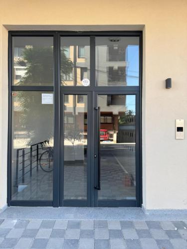 an entrance to a building with glass doors at Royal Apartments in Skopje