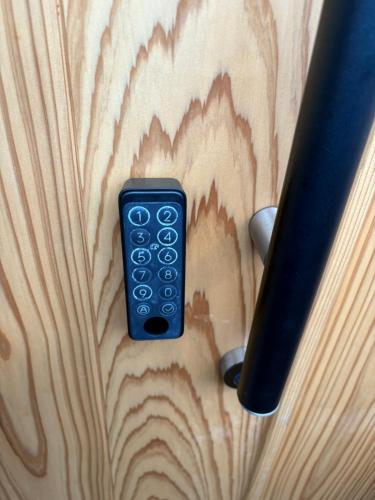 a blue remote control sitting on top of a table at the room 20 in Hakodate
