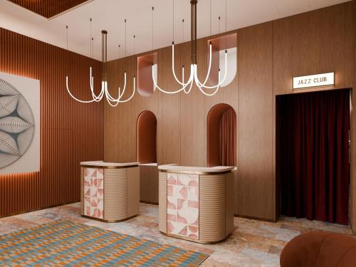 a lobby with two tables and a chandelier at Rosetta Hotel Perugia Tapestry Collection By Hilton in Perugia