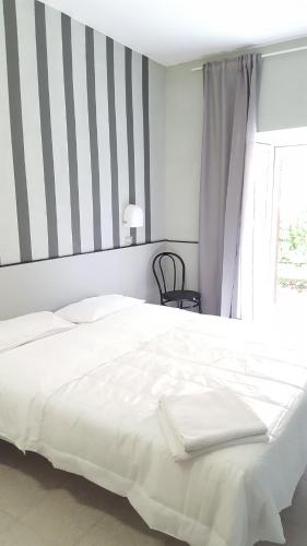 Ένα ή περισσότερα κρεβάτια σε δωμάτιο στο Hotel Al Sogno
