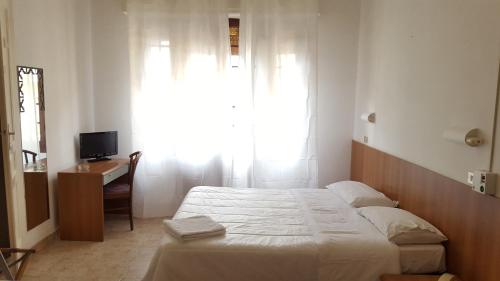 Łóżko lub łóżka w pokoju w obiekcie Hotel Al Sogno