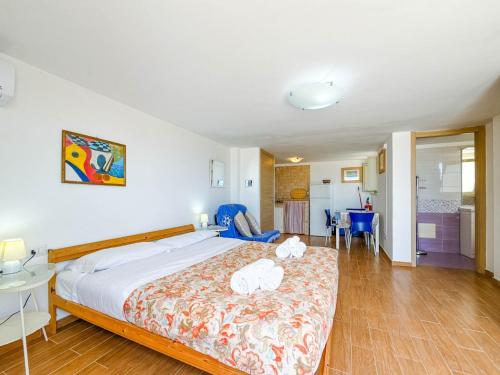 a bedroom with a bed with two stuffed animals on it at Il Mare In Giardino in Scauri