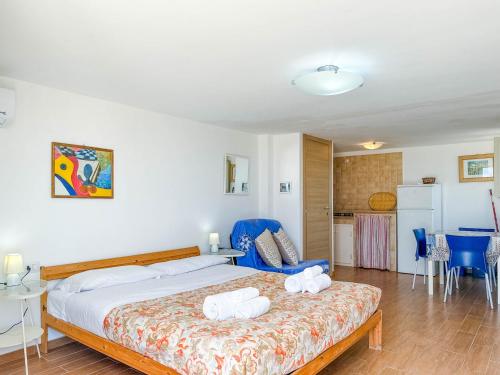 a bedroom with a bed with two towels on it at Il Mare In Giardino in Scauri