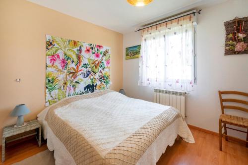 a bedroom with a bed and a window at Villa d exception 3 étoiles in Clermont
