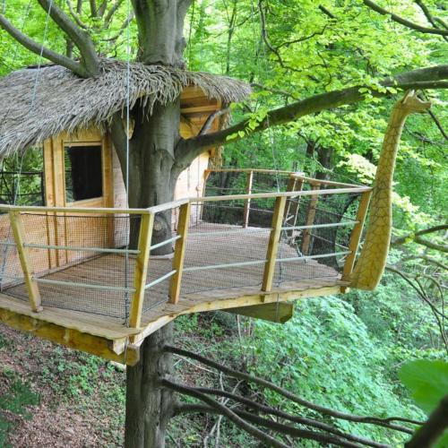 a tree house hanging from a tree at Domaine de Fontaine Châtel in Saint-Germain-des-Essourts