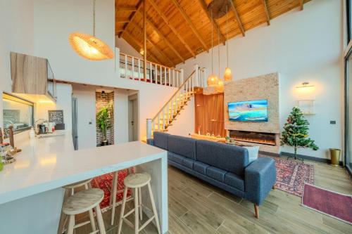 a kitchen and living room with a blue couch at Grand Paradise Resort Sapanca in Sapanca