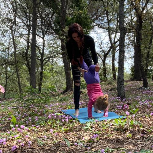 a woman and a child playing with a kite at POGGIO ROSETO in Randazzo