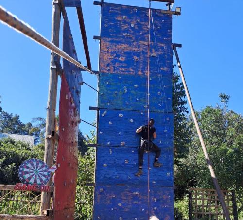 a man climbing on a climbing wall at Beach Island Graskop in Graskop