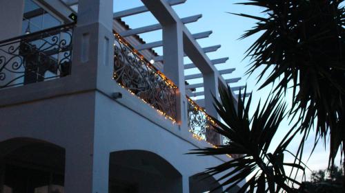 a building with a balcony with lights on it at Constantin in Dhémbla