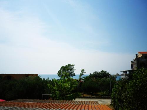 a view of the ocean from a house at Panorama Apartments in Povljana