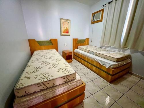 Postel nebo postele na pokoji v ubytování Apartamentos Sol das Caldas