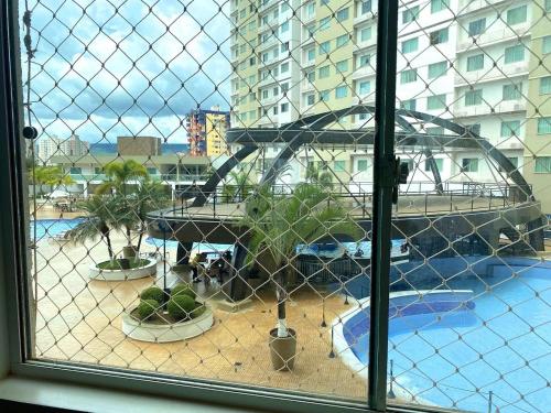 a view of a playground from a window at Apartamentos Riviera Park in Caldas Novas