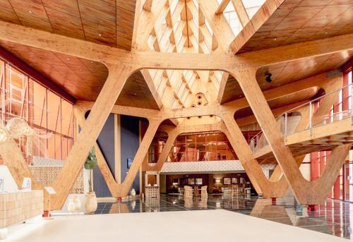 a view of the lobby of a building with wooden ceilings at Holiday Premium Resort in Benalmádena