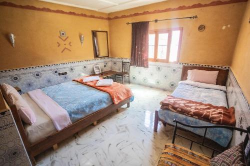 Postel nebo postele na pokoji v ubytování Riad La Fleur