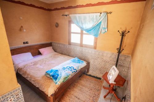Postel nebo postele na pokoji v ubytování Riad La Fleur