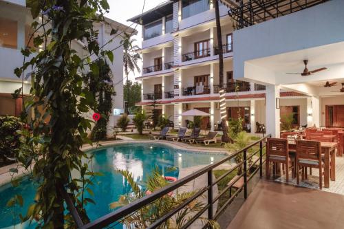 a view of a hotel with a swimming pool at The Verda De Miranda Resort Morjim North Goa in Morjim