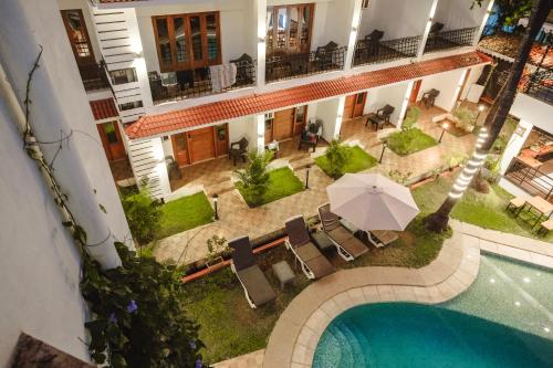 an aerial view of a hotel with a swimming pool at The Verda De Miranda Resort Morjim North Goa in Morjim