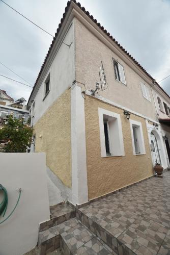 a large building with at Nicol apartment in Skoutaros