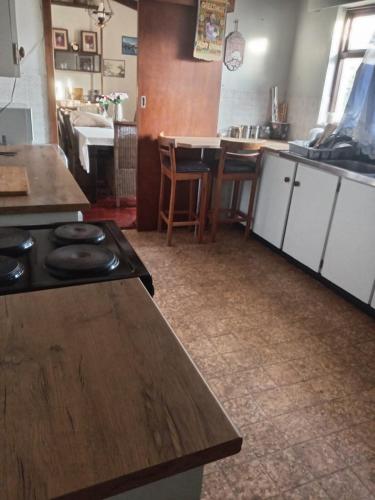 a kitchen with a stove and a counter top at Halibut Suite in Strand