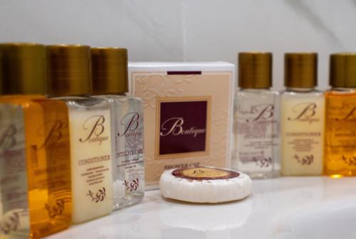 a group of bottles of hair products sitting on a counter at Tiber Suite in Rome