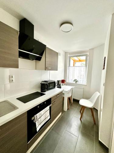 a kitchen with a sink and a stove at Stendaler Apartments in Stendal