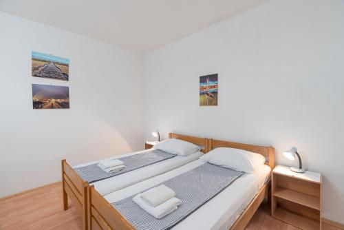 Posteľ alebo postele v izbe v ubytovaní Apartment Slava