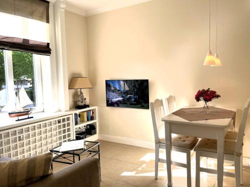 TV/trung tâm giải trí tại Südstrand- Inselstübchen 7, Gmelinstraße