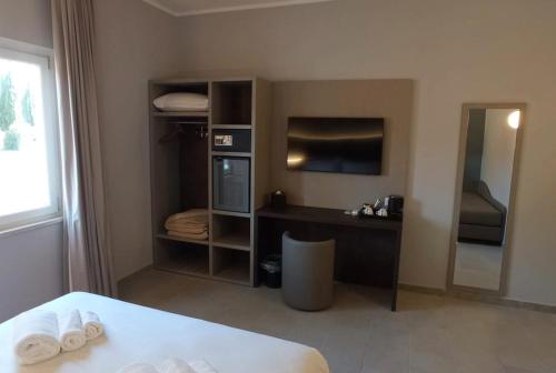 a hotel room with a bed and a television at Tiber Suite in Rome