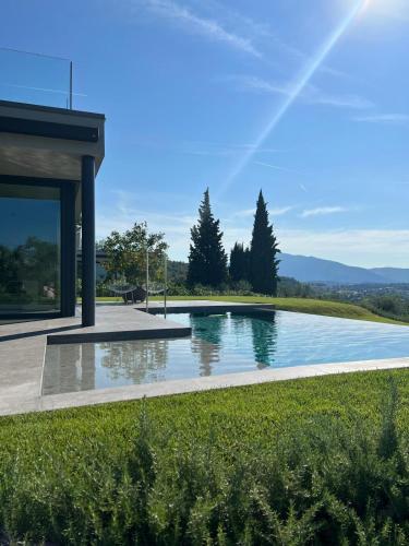 a swimming pool in the yard of a house at Villa La Biancolilla in Marciaga