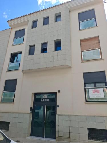 a building with a door in front of it at Primi House in La Nucía
