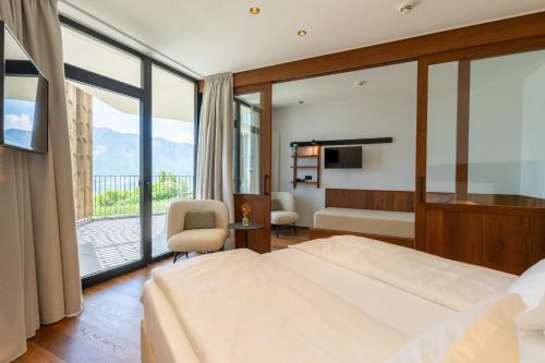 Posteľ alebo postele v izbe v ubytovaní Hotel Tenz