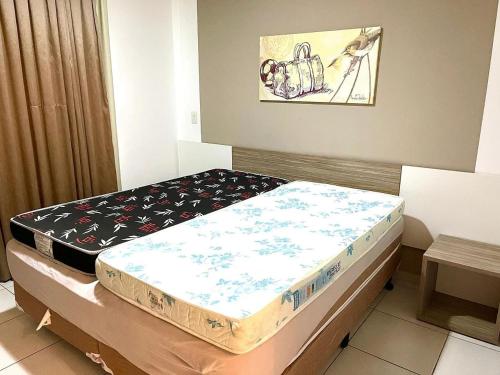 a room with two beds in a room at Apartamentos Riviera Park in Caldas Novas