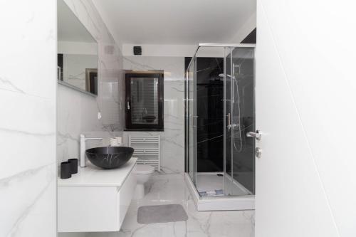 a bathroom with a glass shower and a sink at NEW! Apartment in Petrčane 30 meters from the sea - TA Leut Agency in Petrcane
