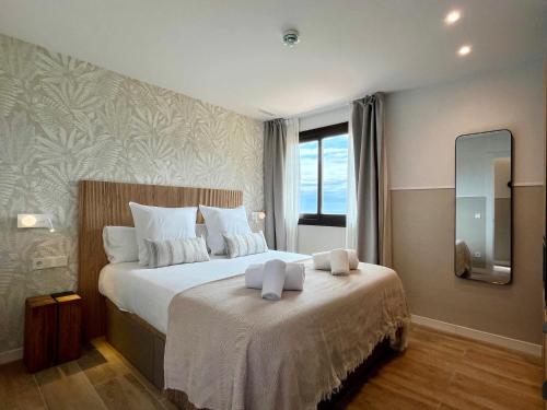 เตียงในห้องที่ Feelathome Vil-la Romana