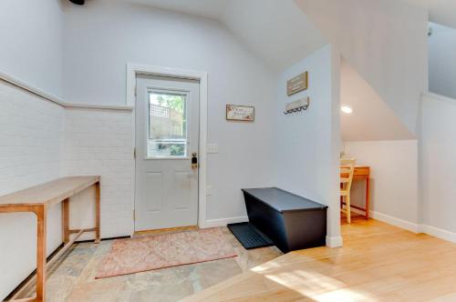 an empty room with a desk and a door at The Estate House in Excelsior