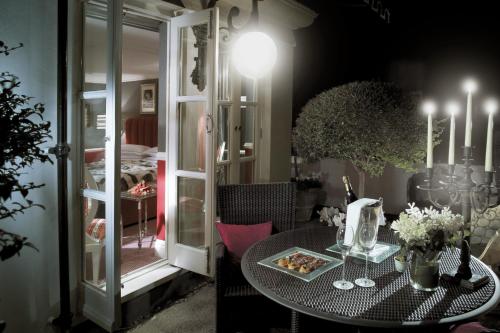 a table with a plate of food on it at Milestone Hotel Kensington in London