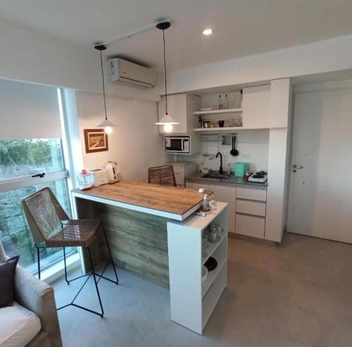 a kitchen with a counter top in a room at Jacaranda Olivos Lofts in Olivos