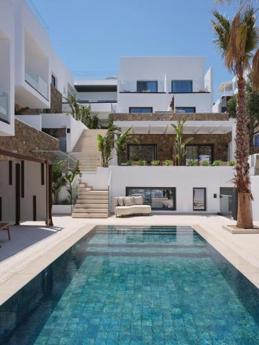 an image of a swimming pool in a house at Iria Blue Mykonos in Platis Yialos Mykonos