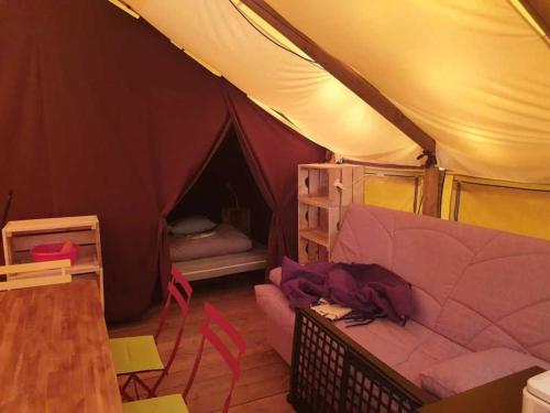 a living room with a tent with a couch at Camping 3 étoiles - ccaiaah in Monoblet