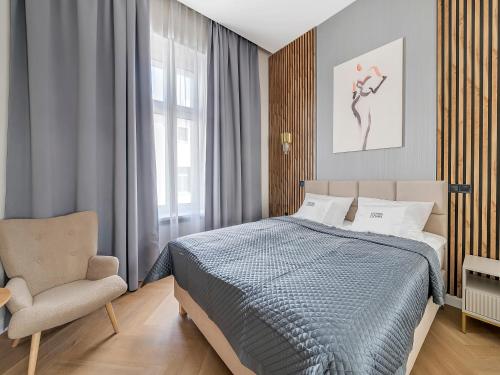 Katil atau katil-katil dalam bilik di WSCHODNIA ELEGANS Aparthotel