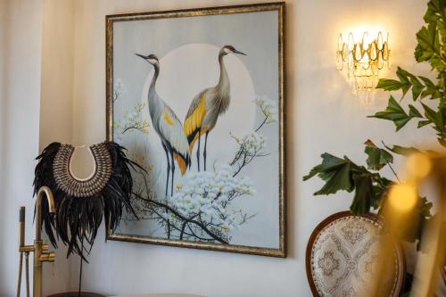 a picture of two birds on a wall at Luxurious Arakana Villa with Pool in Jimbaran