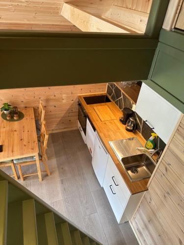 an overhead view of a small kitchen with a table at Haugo Utleige Lodge in Vossevangen