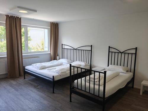Ένα ή περισσότερα κρεβάτια σε δωμάτιο στο Hotel Rahlau