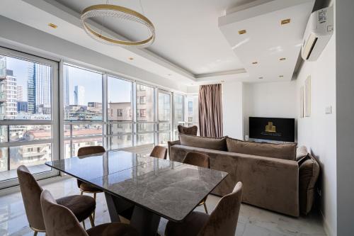 a living room with a table and a couch at J&K Platinum Towers in Warsaw