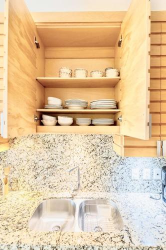 a kitchen counter with a sink and some dishes at ANANA El Dorado 203 | Condo with Lake views & Pool in Ajijic
