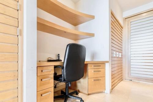 an office with a desk and a chair in a room at ANANA El Dorado 203 | Condo with Lake views & Pool in Ajijic