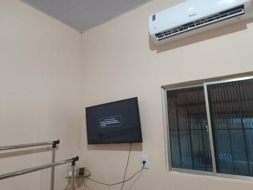 Televisyen dan/atau pusat hiburan di Suite das Mangueiras